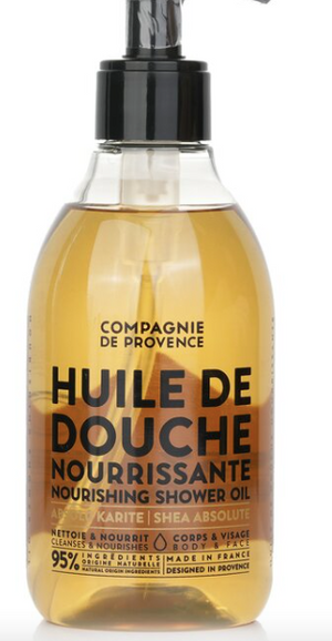 StephanYoung nourishing shower oil with shea butter, showing a clear bottle with golden oil and label details.
