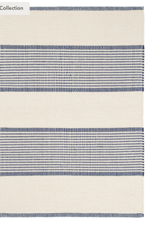Navy handwoven cotton rug from La Mirada collection by AnS, measuring 2x3 feet, with intricate geometric patterns and textured surface.