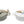 Set of two CCOI Brie bakers with lids and spreaders for cooking and baking, featuring ceramic construction and decorative design.