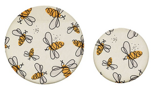 Reusable CCOI beeswax food covers with fun printed designs, perfect for food storage and keeping food fresh.