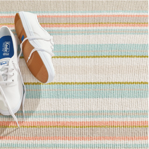 Handwoven cotton rug by AnS with blue and white Daphne Stripe Sky design, measuring 2x3 feet.