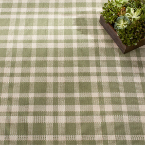 Green and cream plaid pattern with a wooden box of succulents in the top right corner.