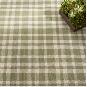Green and cream plaid pattern with a wooden box of succulents in the top right corner.