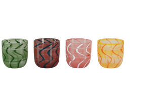 Clear CCOI drinking glass with colorful striped and wave design, perfect for beverages and table setting.