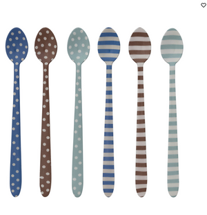Close-up of CCOI BAR cocktail spoons, sleek serveware for mixing and garnishing drinks, with polished metal finish.