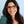 Peepers Sloane blue light eyeglasses with clear lenses and stylish black frames, designed to reduce screen glare.