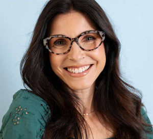 Peepers Sloane blue light eyeglasses with clear lenses and stylish black frames, designed to reduce screen glare.