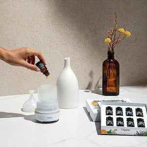 White ceramic aromatherapy essential oil diffuser by Cliganic, featuring a sleek design and mist outlet for relaxing scent diffusion.