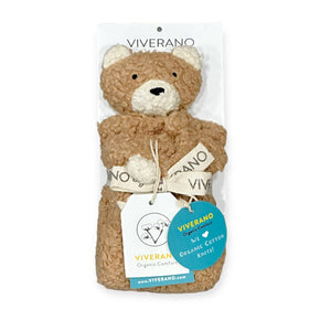 Brown teddy bear with cream accents, tied with a branded ribbon, labeled "Viverano Organic Comfort".