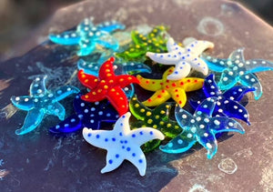 Decorative glass starfish figurine from SHOPGIVECOURAGE, miniature collectible sitter with a detailed, transparent design.