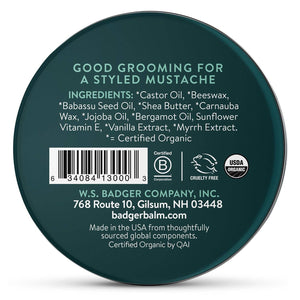 Badger Beauty Badger Mustache Wax with medium hold, shown in a tin container, for styling and grooming mustaches.