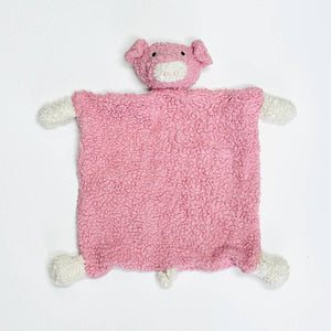 Pink plush blanket with a pig head and small white hooves at corners on a white background.