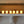 Set of six LumaBase battery-operated LED votive candles with flickering flame effect on a white surface.