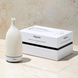 White ceramic aromatherapy essential oil diffuser by Cliganic, featuring a sleek design and adjustable mist output.