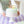 Rainbow Happy Birthday candles from Talking Tables USA arranged on a birthday cake for celebration.