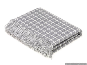 Soft Merino Lambswool throw and pillow from Bronte Moon's Classic Collection, featuring cozy, luxurious textures and neutral tones.