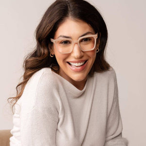 Peepers reading eyeglasses with clear rectangular frames, featuring a classic black and tortoiseshell design, on a neutral background.