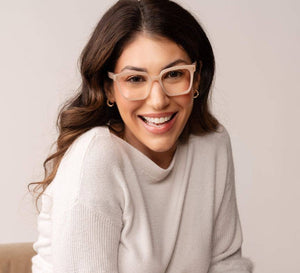 Peepers reading eyeglasses with clear rectangular frames, featuring a classic black and tortoiseshell design, on a neutral background.