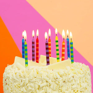 Striped multicolor birthday cake candles from Talking Tables USA, 24-pack, perfect for celebration decor and cake decoration.