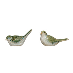 Stoneware bird figurine by CCOI, showcasing two different styles, detailed craftsmanship in a decorative statue for home display.
