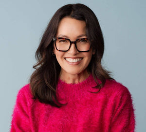 Peepers brand reading eyeglasses with clear lenses and stylish frames, close-up shot showing the design and details.