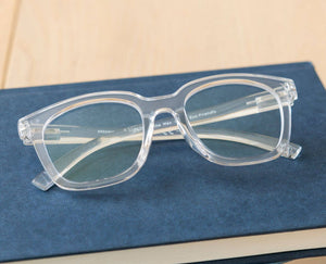 Peepers To the Max reading eyeglasses with clear frames and round lenses, close-up shot showing stylish eyewear.