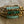 Turquoise glass and brass bracelet set from Nellie Pratt Artisan Jewelry with boho-style design and layered stacking.