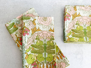 Set of four Dragonfly Garden cloth dinner and cocktail napkins by Dot and Army, featuring elegant floral and dragonfly designs.
