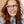Peepers Take a Bow blue light reading eyeglasses with clear frames, designed for comfortable wear and eye protection.
