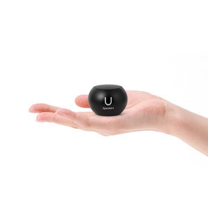 FashionIt U portable Bluetooth speaker in black, compact and stylish, shown with a sleek mini design and textured surface.