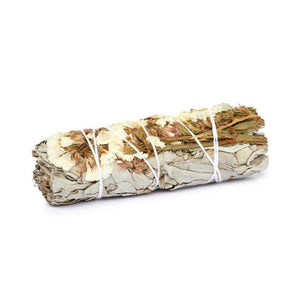 Handmade sage bundle with colorful flowers from Earths Elements Wholesale, showcasing fresh herbs and vibrant floral accents.