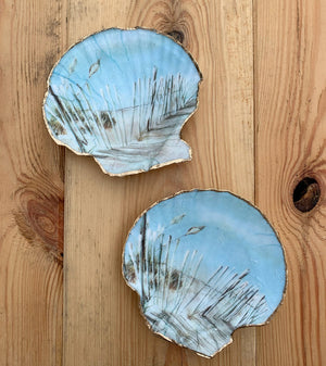 Handmade painted shells from Serenity Shells, showcasing colorful, unique seashells with intricate painted designs.