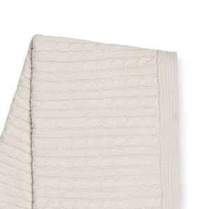 Beige textured fabric with a subtle cable knit pattern and ribbed edge.