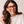 Pair of Peepers Spotlight eyeglasses readers with clear lenses and stylish frame, resting on a neutral surface.