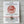 White card with a red horse design, text about Year of the Horse 2026, and a red string bracelet.
