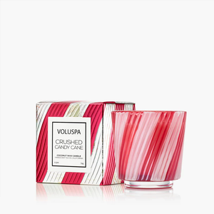 Red and white striped candle and box with "Voluspa Crushed Candy Cane" label on a white background.