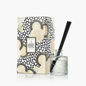 Voluspa Jasmine Midnight Bloom reed diffuser 3.4oz with elegant glass bottle and reed sticks for home fragrance.