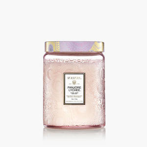 Large 18oz Voluspa Panjore Lychee scented candle in a clear glass jar with a decorative metallic lid.