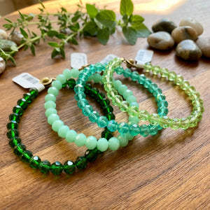 Green crystal bracelet from Pleasant Beach Living featuring multiple shades of green in a stylish jewelry design.
