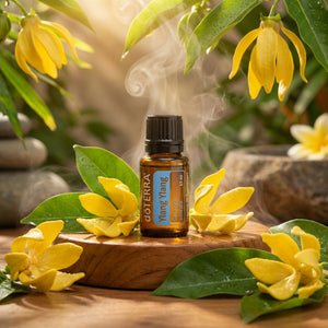 Brown bottle with blue label surrounded by yellow flowers and green leaves, emitting steam.