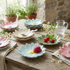 Small flower-shaped dinner plate by CCOI with reactive glaze finish, showcasing vibrant floral design and glossy surface.