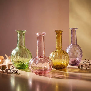 Hand-blown recycled glass vases in four styles from CCOI, featuring smooth curves and transparent designs perfect for home decor.