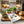 Cat figurine, fresh herbs, rustic bread, and 