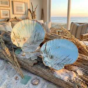 Handmade painted shells from Serenity Shells, showcasing colorful, artistic designs on natural seashells.