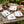 Set of four cocktail linen cloth napkins with insect embroidery by Dot and Army, featuring intricate insect designs on soft linen fabric.