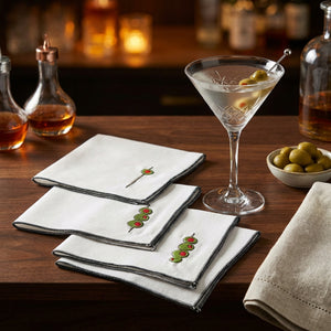 Set of four white Martini Olive Cloth Cocktail Napkins by Dot and Army, featuring elegant, soft fabric suitable for parties and gatherings.