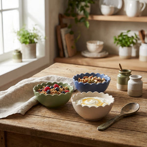 Stoneware scalloped bowl by CCOI, showcasing a round bowl with a textured, scalloped edge and neutral color for kitchen use.