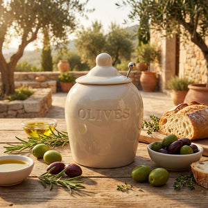 Set of two CCOI stoneware jars with slotted spoons, decorated with "Olives" debossed design, ideal for kitchen food storage.