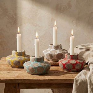 Terracotta candle holder with wax relief dots for tealight or taper candles, by CCOI, showcasing a rustic, textured design.