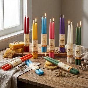 Set of 100% pure beeswax tapers candles by Big Dipper Wax Works, natural golden-colored candles with unburned wicks.